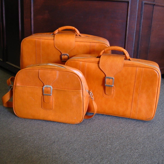 orange samsonite suitcase