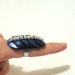 Leather contemporary claw ring. Blue metallic claw ring