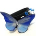 Narrow leather bracelet with blue butterfly