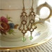 DECO DANGLERS - Vintage 1960's Brass Art Deco Style Drops and Green Peridot Swarovksi Crystals on Antiqued Brass Shepherd's Hook Pierced Earrings - Pieces of the Past Collection - PreciousPastimes - SRAJD