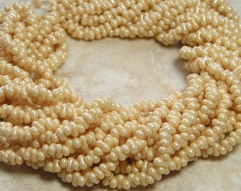 4x2mm Opaque Eggshell Czech Glass Farfalle Seed Bead Strand (AW105)