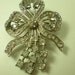 Vintage 1930s or 1940s Clear Rhinestone Silvertone Ribbon Pin
