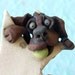 Chocolate Labrador Retriever Dog Hanging on a Star Ceramic Sculpture or Ornament