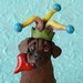 Chocolate Lab Holding a Heart Ceramic Sculpture: Fool for Love