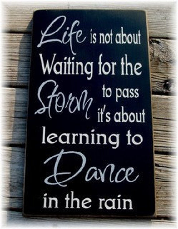 Life is not about waiting for the storm to by woodsignsbypatti