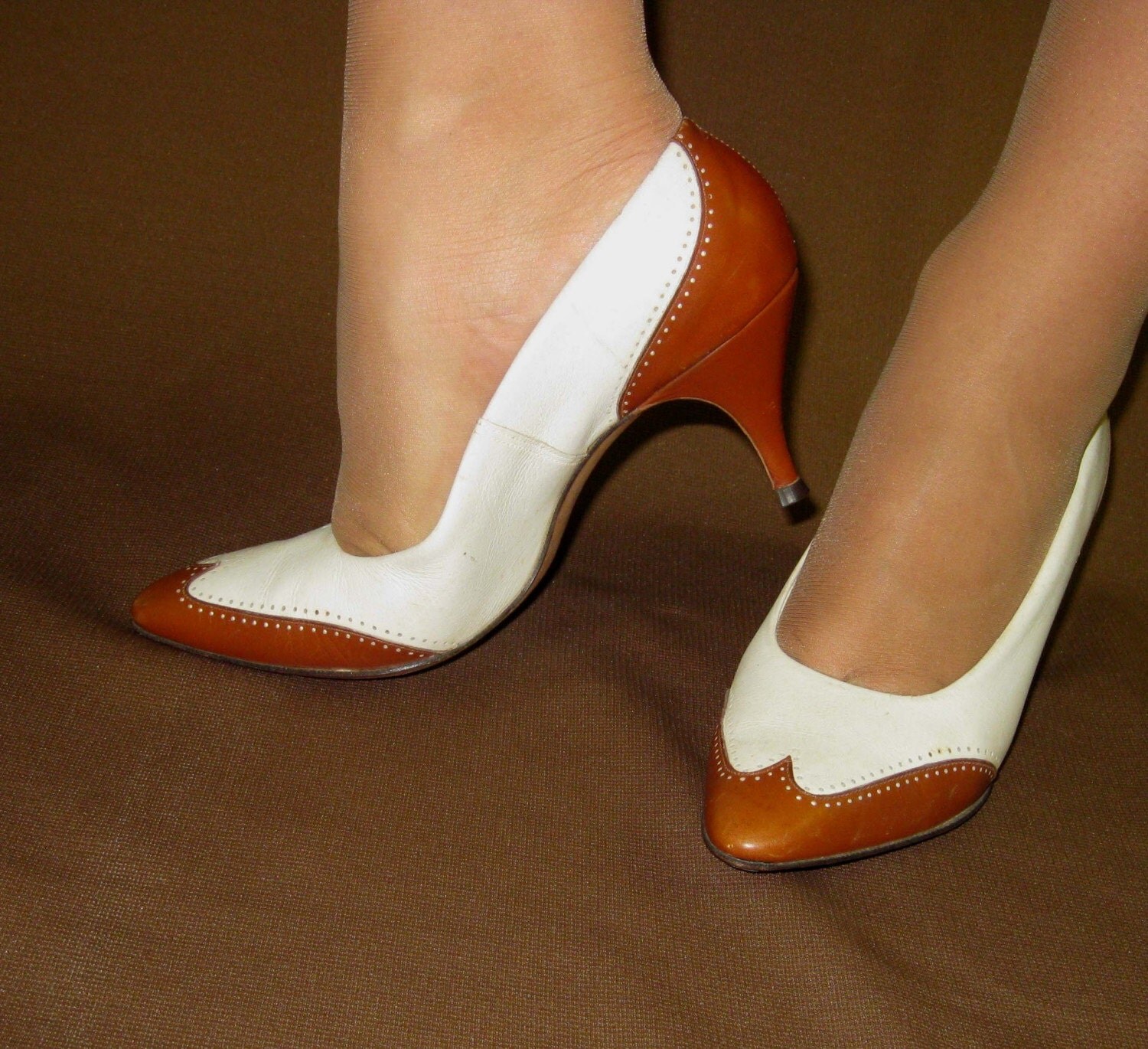 red and white spectator pumps