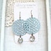Large pale blue filigree earrings with vintage glass rhinestones. Big bold shabby chic style.