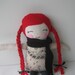 Handmade cloth doll with red hair and long braids with Japanese linen body featuring a cat band.