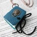 The Lion Knocker - elegant book necklace with copper chain. a locket for your thoughts.