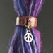 dreadlock bead with a charm