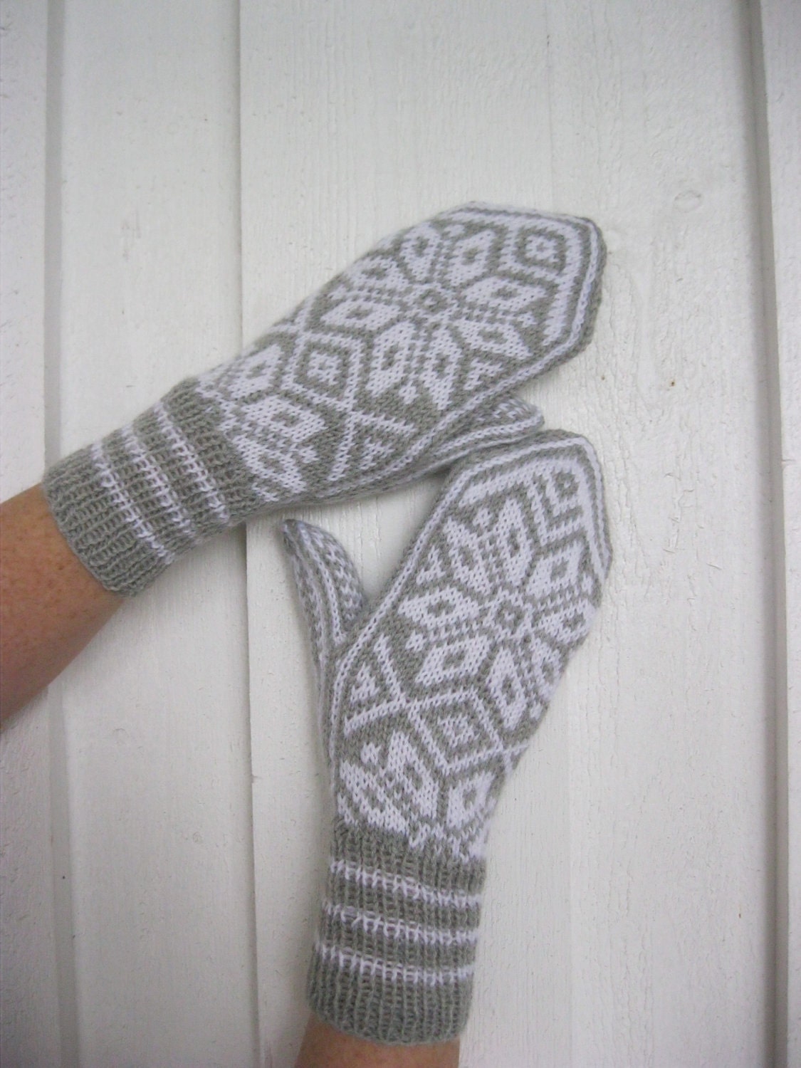 Handknitted wool mittens with norwegian pattern.