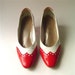 red and white spectator pumps