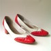 red and white spectator pumps