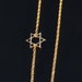 14kt Gold Star of David Necklace set Off Center