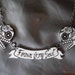 Black and White filigree Sugar Skulls with banner necklace