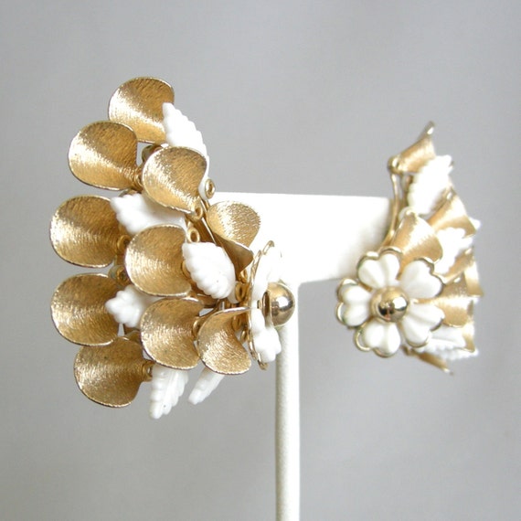 Large vintage gold metal and white plastic flower earrings
