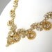 Detailed vintage gold and rhinestone bib necklace