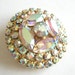 Vintage gold tone brooch with Aurora Borealis rhinestones
