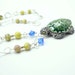 Turtle necklace made with Peruvian clay, lepidolite, and Swarovski crystal