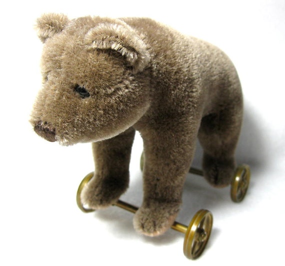 old steiff bear on wheels