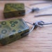 niobium earrings in olive green ocean jasper. polka dot earrings. wire wrapped briolette earrings. splurge.