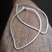 leaf earrings. silver hoop earrings. modern leaf hoop earrings. eco sterling silver earrings. splurge.