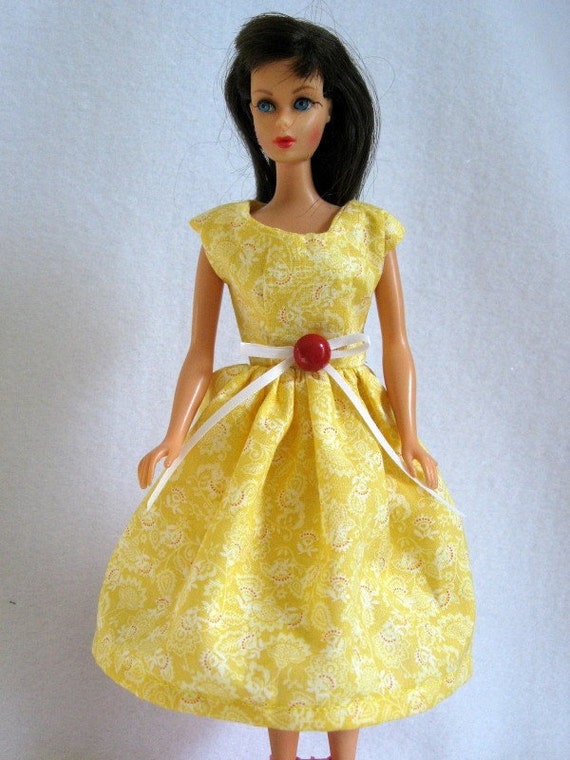 barbie doll in yellow dress