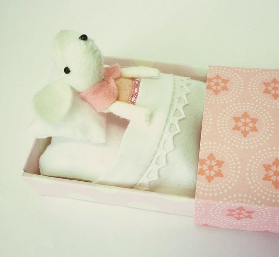 White mouse plush in matchbox bed patterned pink