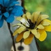 Yellow Metal Barbwire Stemmed Flower with Natural Wood Base