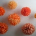 orange craft pompoms