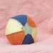 Wool felt baby ball naturally dyed with rattle inside