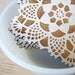 square doily coasters with natural woodgrain