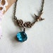 Garden Love - A Vintage Blue Aqua Octagon Glass Jewel with Floral Connector and Flying Swallow Necklace. A Sweet Romantic Gift.