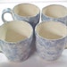 4 Coffee Tea Cups Cloud Blue Spongeware Handmade Pottery Bright White Interior