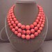 Island Coral -- Genuine Salmon Coral Triple-Strand necklace