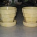 2 mid century McCoy Pottery basketweave textured small yellow flower pots with attached saucers