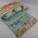 Diaper Clutch with clear zipper pouch-- Cosmo Textile Border Strips Amusement Park
