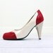 red and white spectator pumps