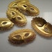 6 brass mask charms
