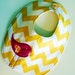 Yellow chevron baby bib with hot pink birdie