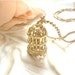 Golden Bird Cage Necklace