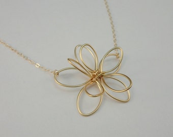 Items similar to Elegant Gold Flower Necklace on Etsy