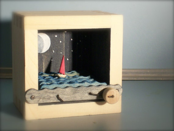 red sailboat at night automata