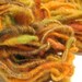Orange Spritzer handspun sparkly corespun art yarn 60 yds