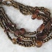 Multi strand vintage bead necklace in shades of coppery brown