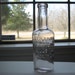 NEWBROS HERPICIDE KILLS THE DANDRUFF GERM Antique bottle