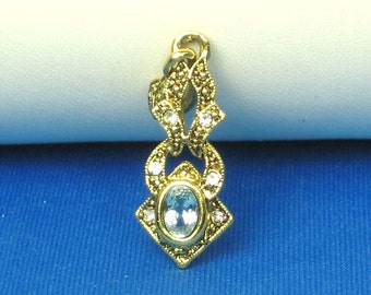 Gold Tone Metal and Blue Glass Gemstone Pendant