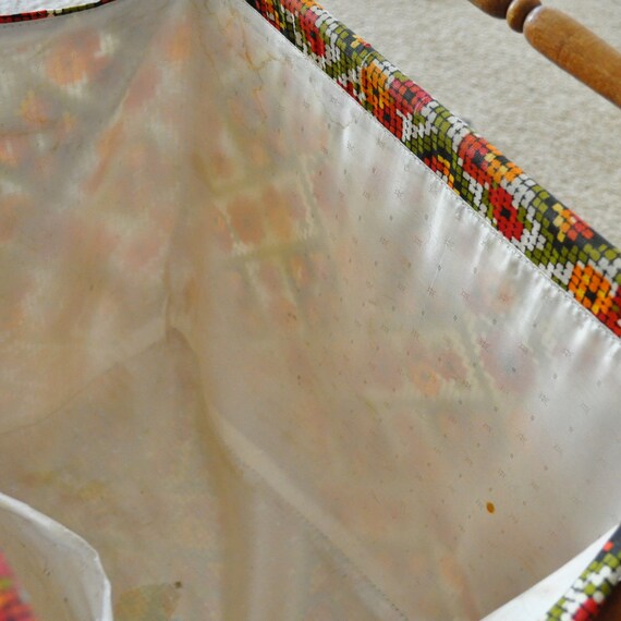 vintage sewing or knitting basket on wooden stand