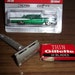 gold safety razor with a box of razors