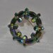 1960s Aurora Borealis Coated Green Rhinestone Circle Vintage Pin